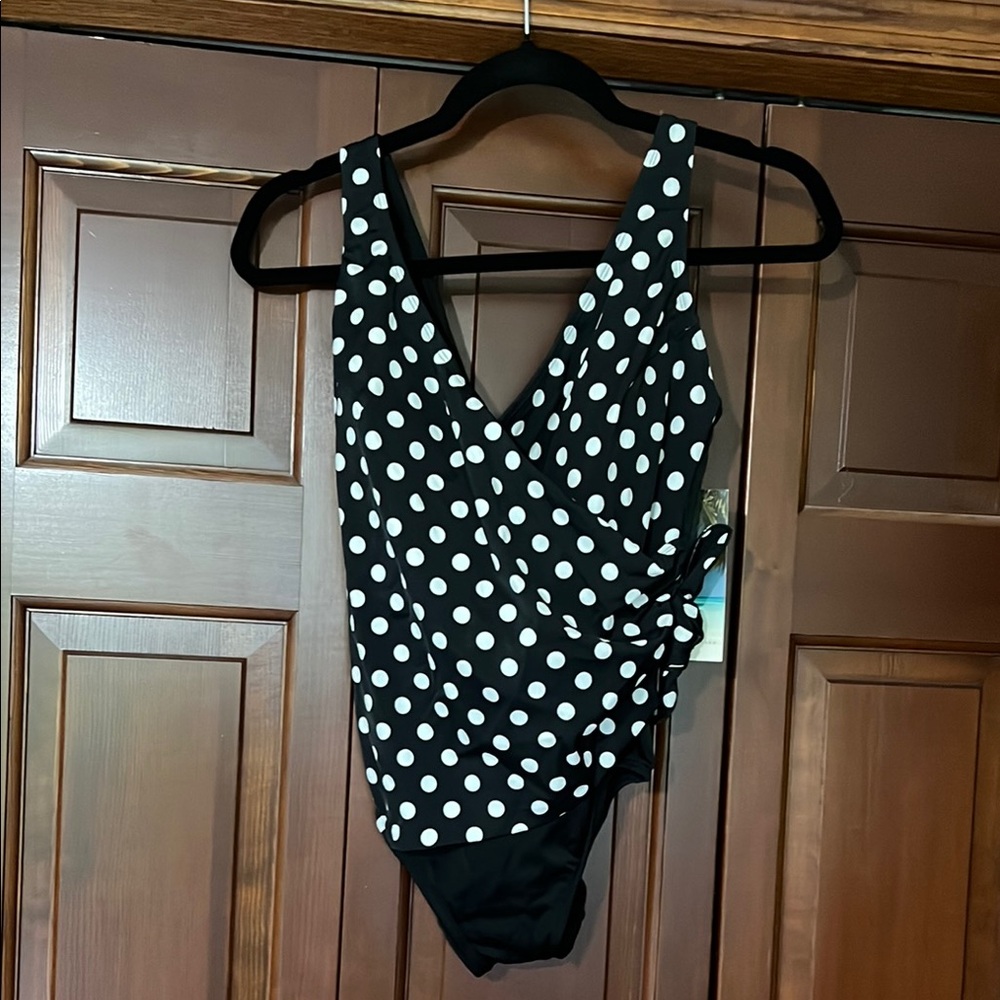 NWT. Black and white polkadot one piece swimsuit. Wrap front. Ladies size 8.